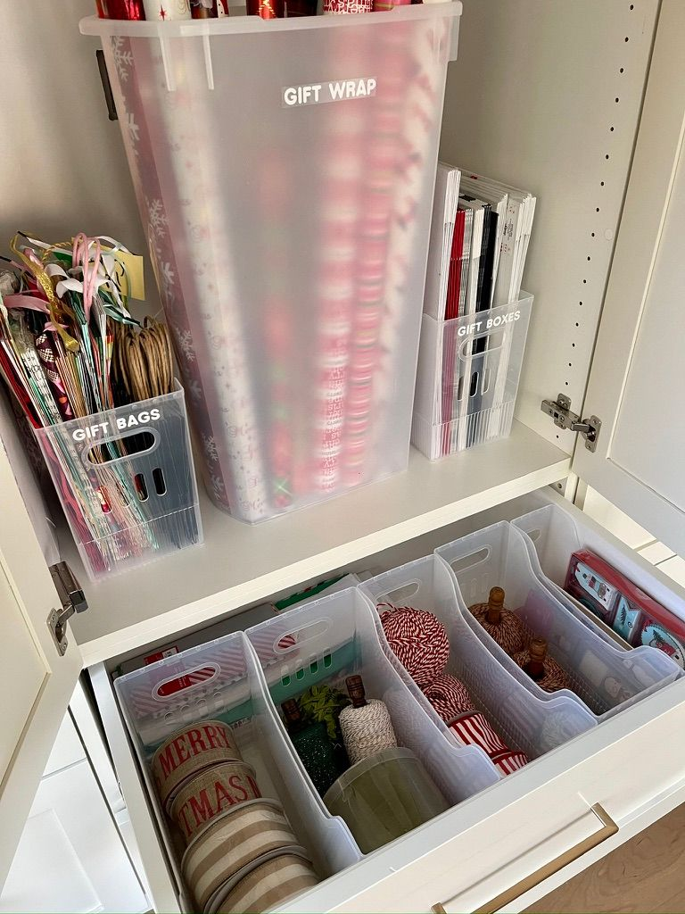 Organized wrapping station with tall gift-wrap bins 