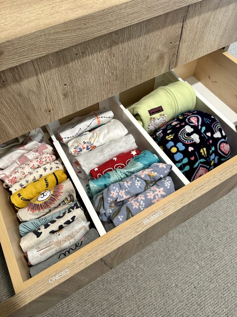 kids bedroom organization - Kids bedroom organization Drawer dividers organizing folded kids’ clothes and pajamas inside a dresser for an easy-to-maintain system
