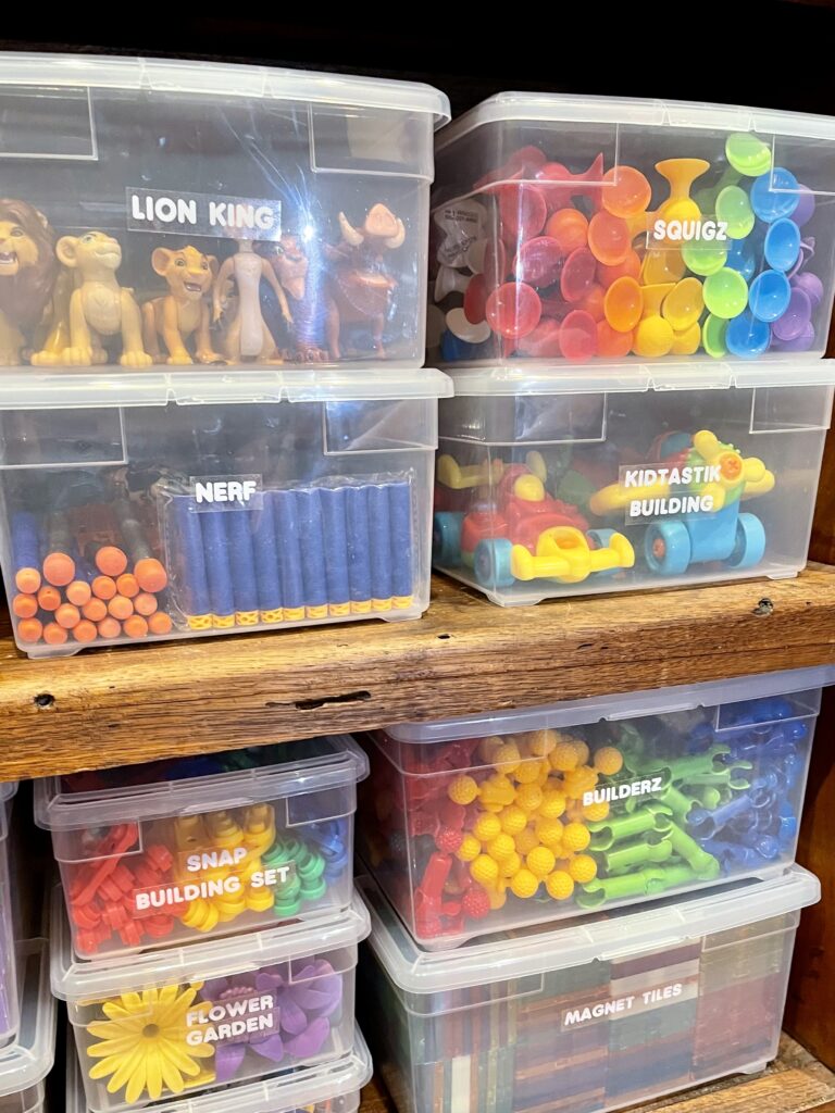 kids bedroom organization - Kids bedroom organization Clear labeled bins organizing kids’ toys and building sets on shelves for a simple, easy-to-find storage system