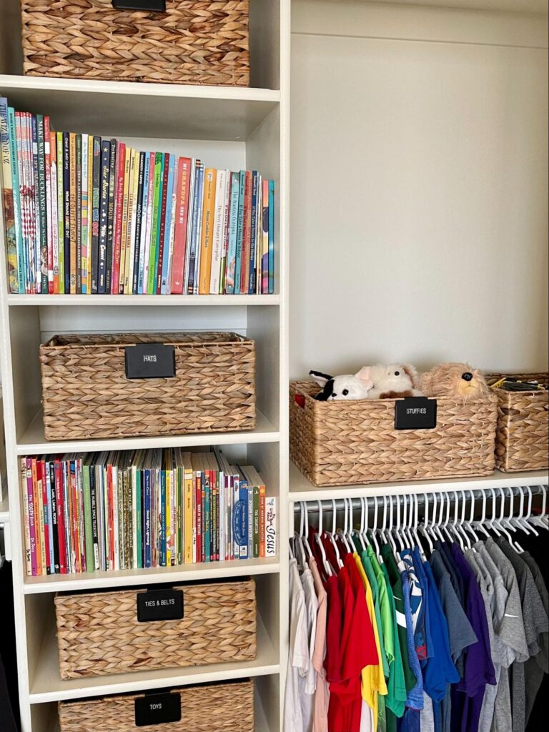 kids bedroom organization - Kids bedroom organization Kids’ closet shelving with labeled baskets, neatly arranged books, and color-sorted clothes on hanging rods