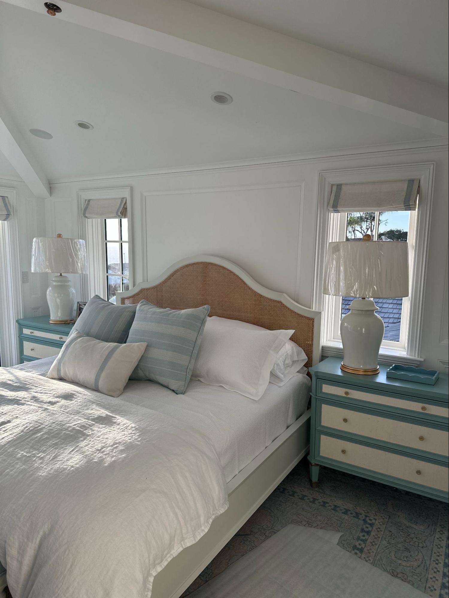 Bright master bedroom that is fully organized by Tracy