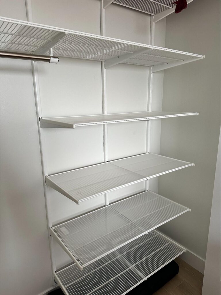 linen closet organization - Home Organization Empty linen closet with white wire shelves and hanging rod, ready for organization and storage setup