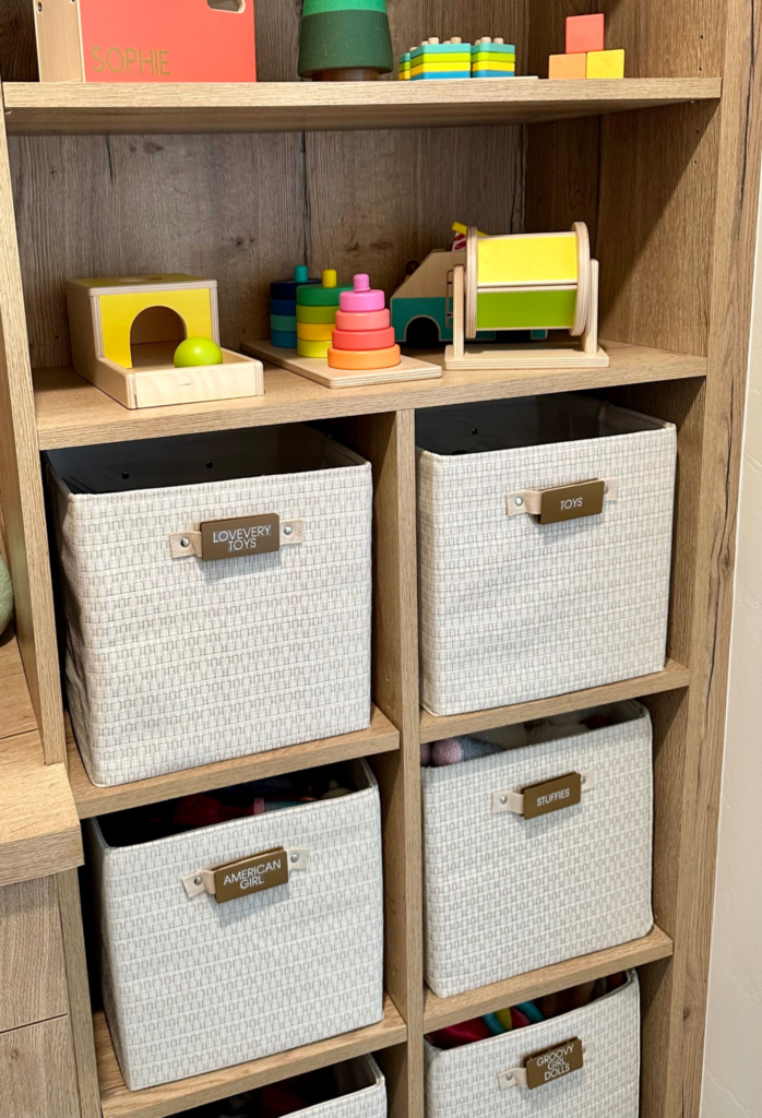 Toy rotation ideas - Kids bedroom organization Toy rotation shelf with labeled fabric bins, Montessori toys, and organized kids toy storage ideas for a clutter-free playroom.