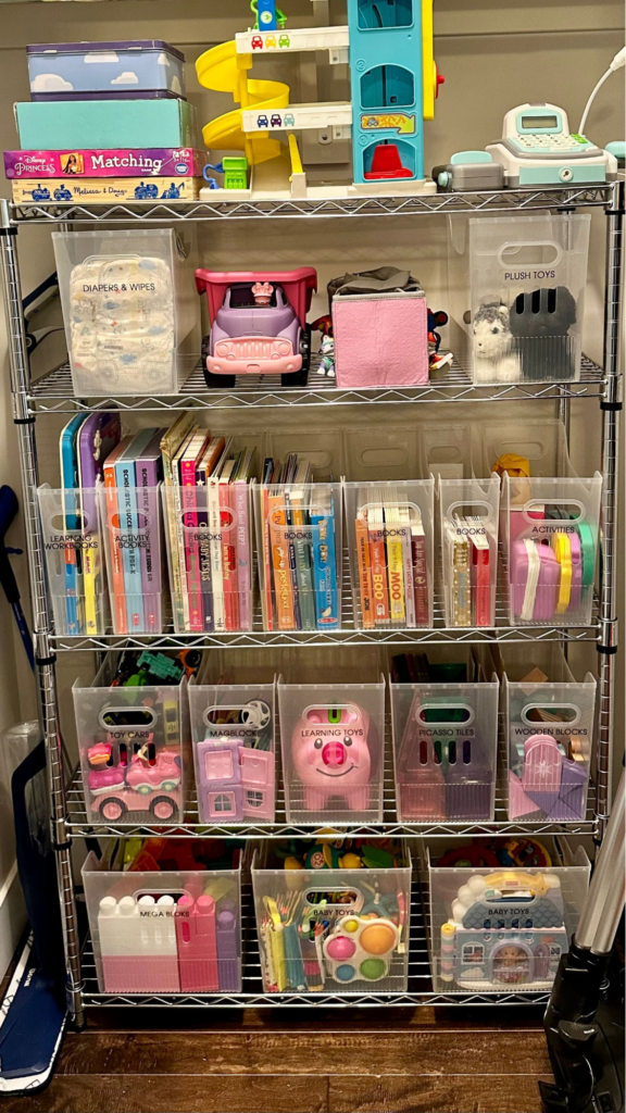 Toy rotation ideas - Kids bedroom organization Organized metal storage shelves with labeled bins for books, toys, stuffed animals, and kids activities.