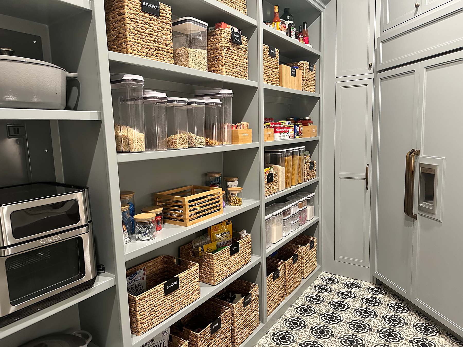 Gray kitchen shelves organized by Organize Simply home organizing team