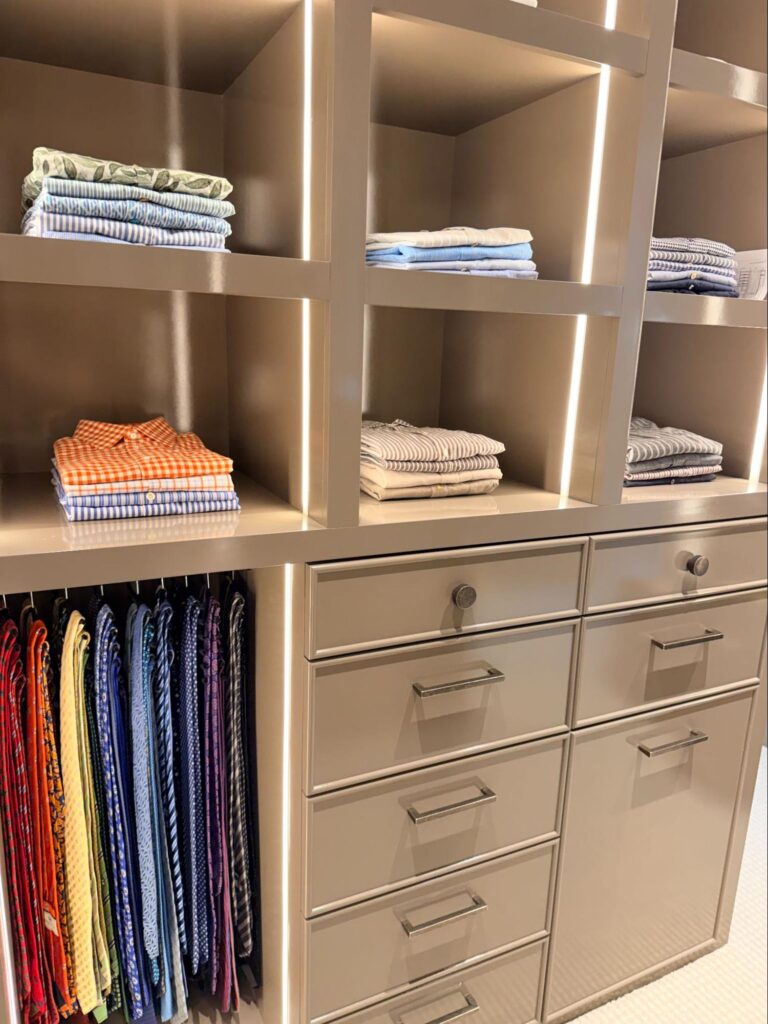 walk in closet organization - Closet Organization Custom walk-in closet with spacious open shelves, neatly folded clothing, built-in drawers, and hanging pants.