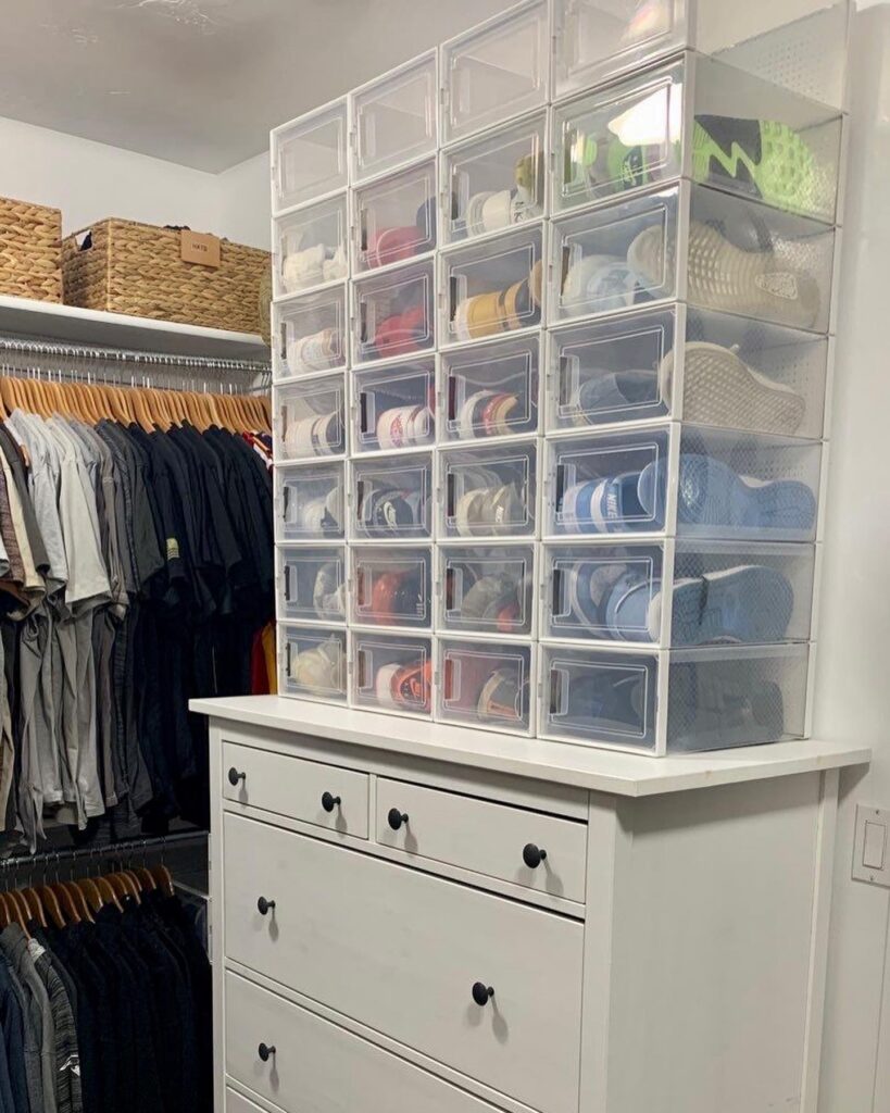 walk in closet organization - Closet Organization Stackable clear shoe storage boxes displaying organized sneakers above a white dresser in a walk-in closet.