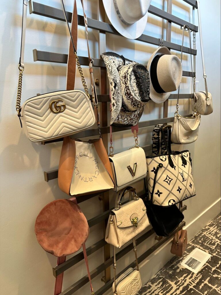 walk in closet organization - Closet Organization Wall-mounted handbag and hat organizer displaying purses and accessories in a walk-in closet.